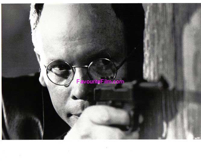 RAIDERS OF THE LOST ARK: B/W Still Colonel Dietrich Points Gun