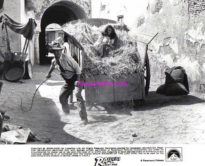 RAIDERS OF THE LOST ARK: B/W Still Indy & Marion in Hay Cart
