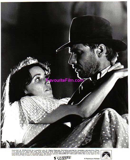 RAIDERS OF THE LOST ARK: B/W Still Indy Carries Marion 