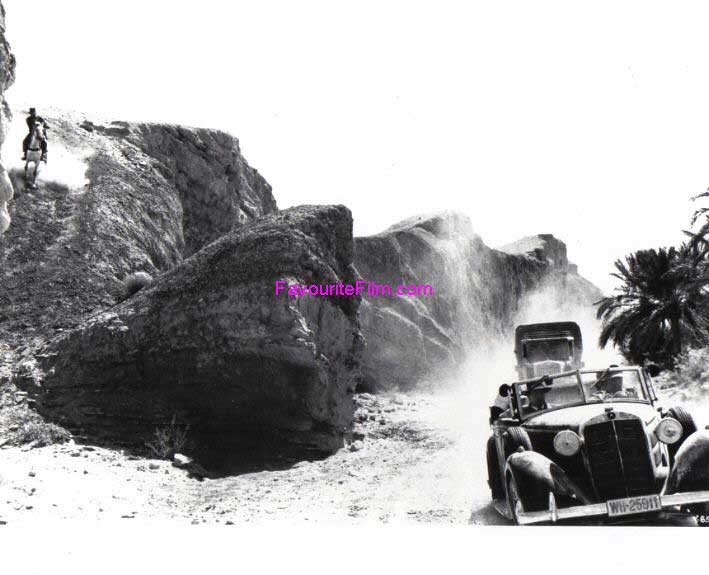 RAIDERS OF THE LOST ARK: B/W Still Indy Chases Down Slope