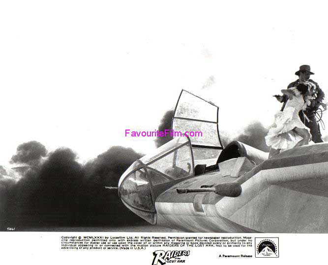 RAIDERS OF THE LOST ARK: B/W Still Indy & Marion on Plane