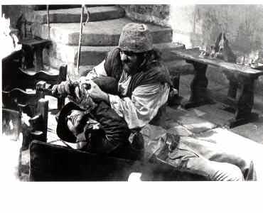 RAIDERS OF THE LOST ARK: B/W Still Indy Grapples on Table