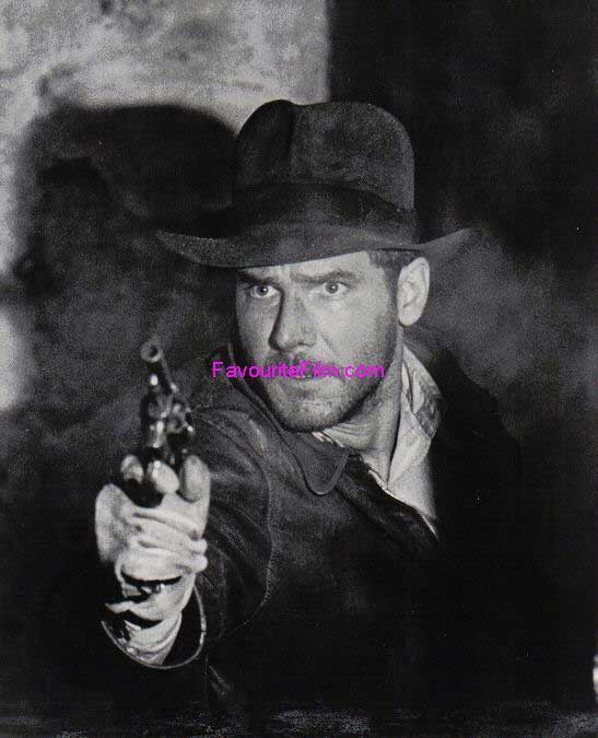 RAIDERS OF THE LOST ARK: B/W Still Indy Shoots Gun