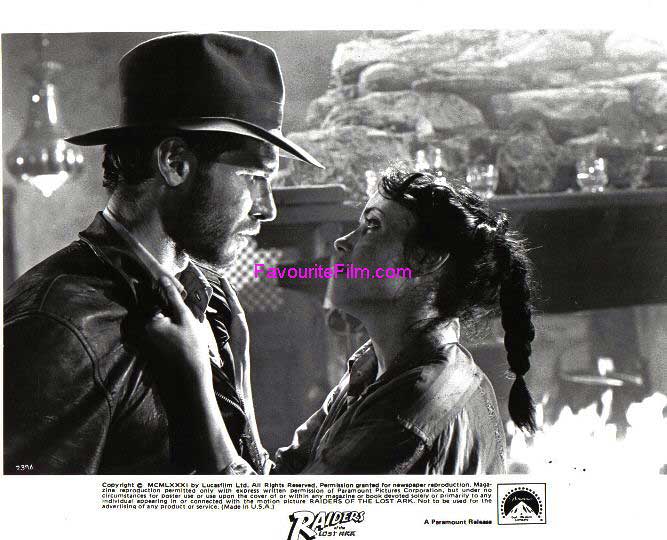 RAIDERS OF THE LOST ARK: B/W Still Marion Grabs Indy 