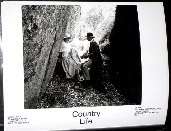COUNTRY LIFE: Publicity Still CL-PR-2 Greta Scacchi and Sam Neill by Rocks 
