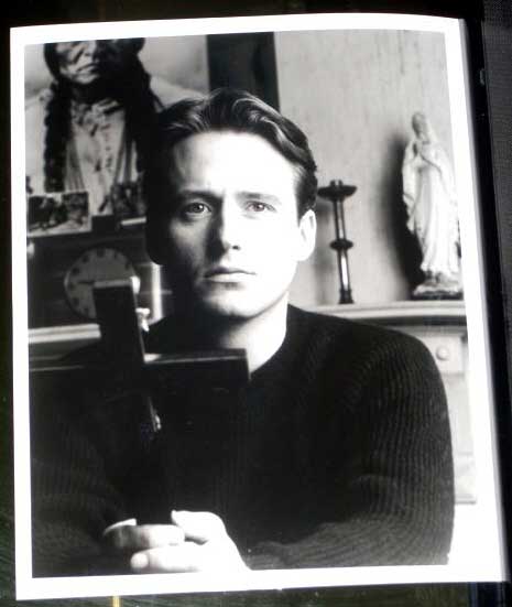 PRIEST: Publicity Still Linus Roache Holding Cross 