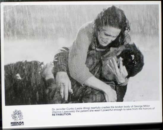 RETRIBUTION: Publicity Still Wing and Lipscomb in Rain 