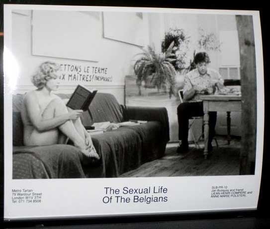 SEXUAL LIFE OF THE BELGIANS, THE: Publicity Still Naked Reading a Book SLB-PR-10 